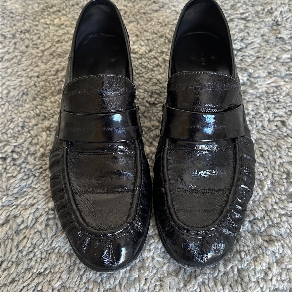 The Row Black Patent Leather Penny Loafers